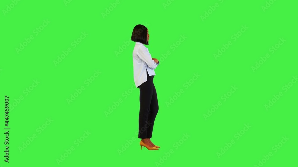African american female, office worker Successful afro businesswoman crossing arms touching chin on a Green Screen, Chroma Key. African american female, office worker Successful afro businesswoman crossing arms touching chin on a Green Screen, Chroma Key.