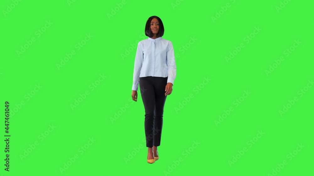 Confident african american woman walk Young multiracial businesswoman moving forward with smile on a Green Screen, Chroma Key. Confident african american woman walk Young multiracial businesswoman moving forward with smile on a Green Screen, Chroma Key.