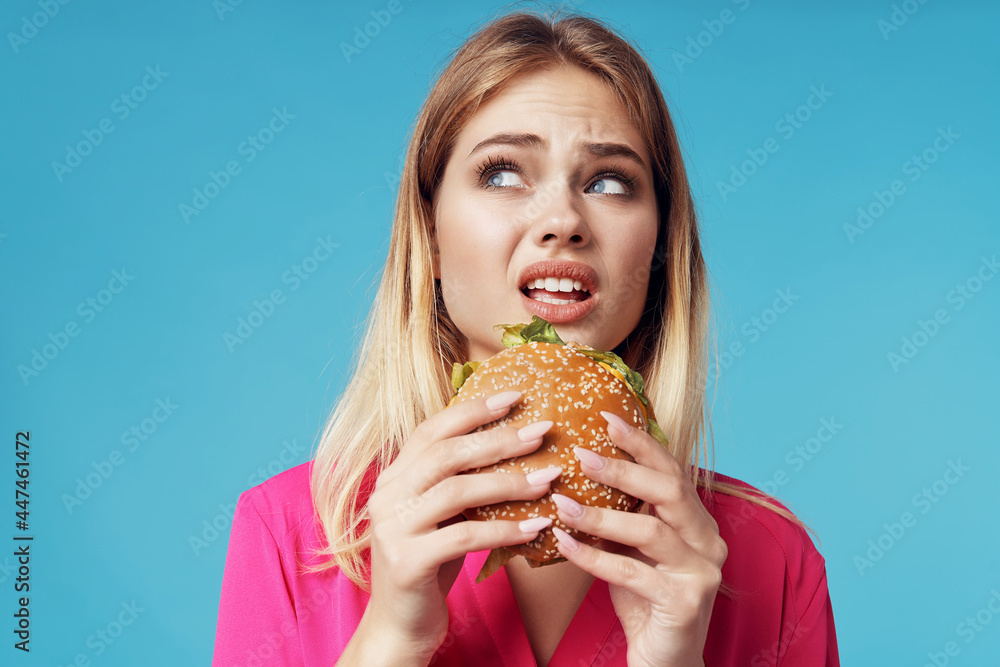 cheerful blonde fast food snack emotion blue background