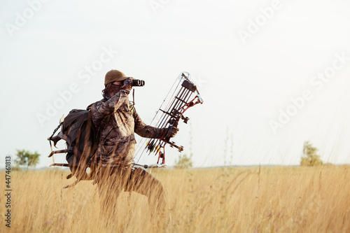 Obraz na plátně Archery hunter scouting for his next target.