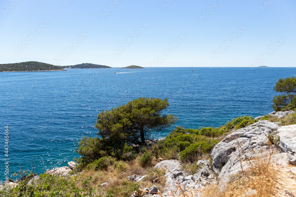 Wonderful view of open sea and islands in archipelago in central Dalmatia from the peninsula of Rogoznica, covered in dense, green pine forest