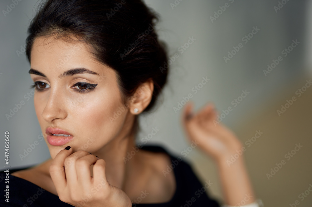 pretty brunette in black dress bracelet on hand studio fashion posing pretty brunette in black dress bracelet on hand studio fashion posing