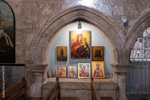 The holy  christian icons in the interior of the St. Jacobs orthodox  cathedral Jerusalem in Christian quarters in the old city of Jerusalem, Israel photo