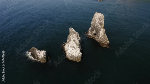 Drone view of the sharp cliffs in the sea photo