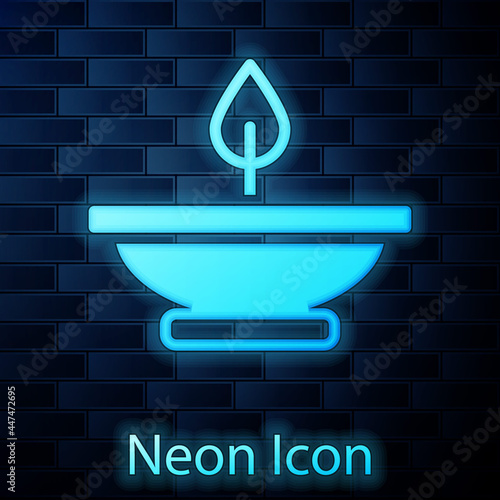 Glowing neon Aroma lamp icon isolated on brick wall background. Vector