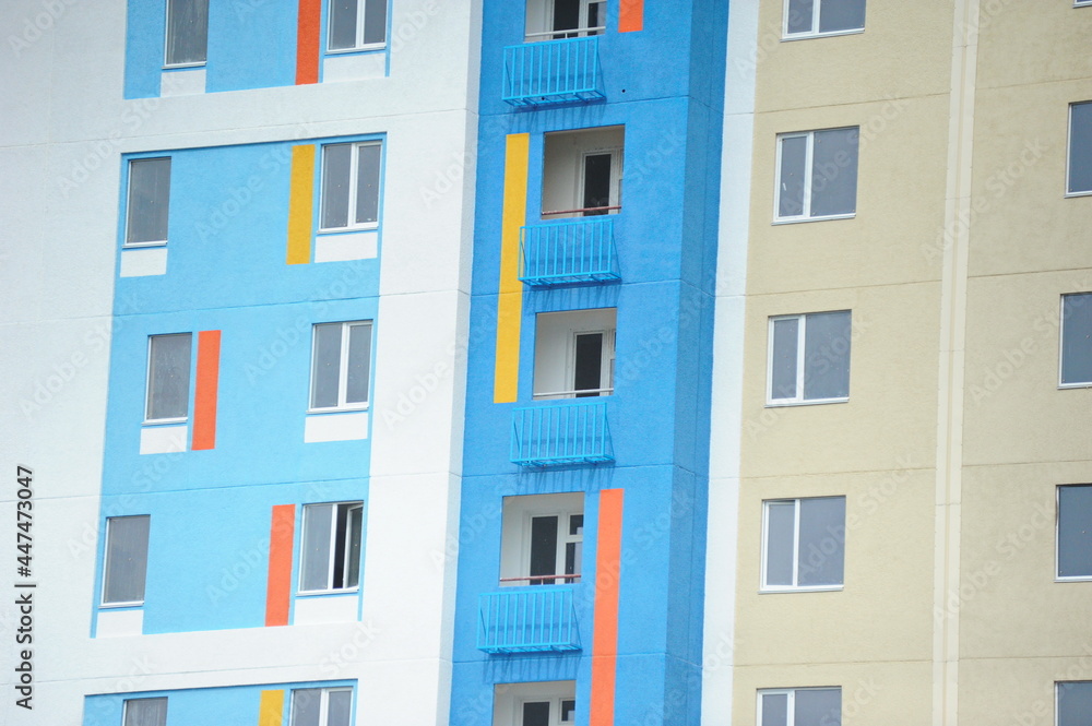 Windows of new residential buildings with different colors on the facade. Windows of new residential buildings with different colors on the facade.