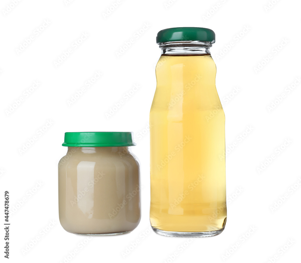 Baby food in jar near bottle of juice on white background Baby food in jar near bottle of juice on white background