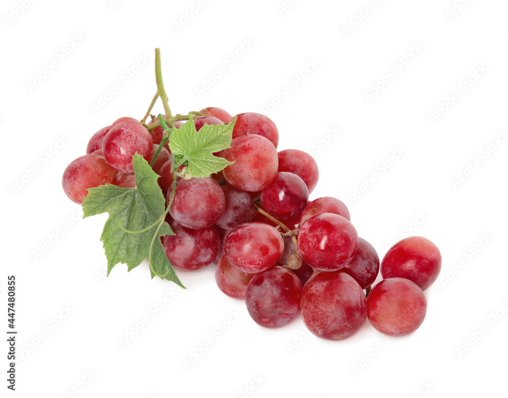 Cluster of ripe red grapes with green leaves on white background, top view