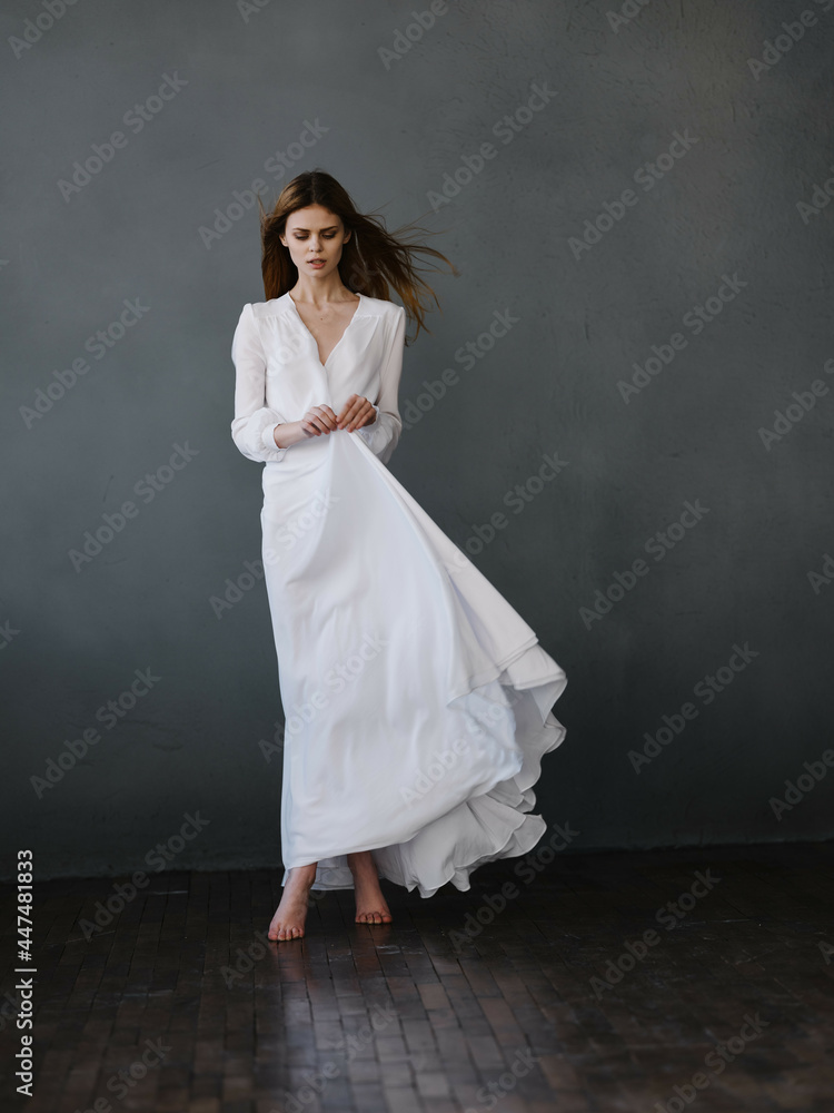 Woman in white dress posing glamor studio Woman in white dress posing glamor studio