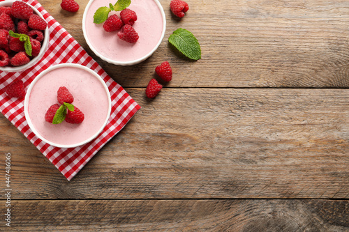 Delicious raspberry mousse with mint on wooden table, flat lay. Space for text