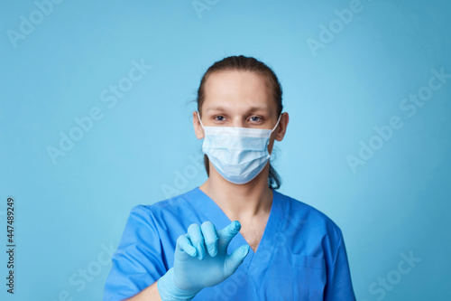 man doctor in uniform touching virtual screen