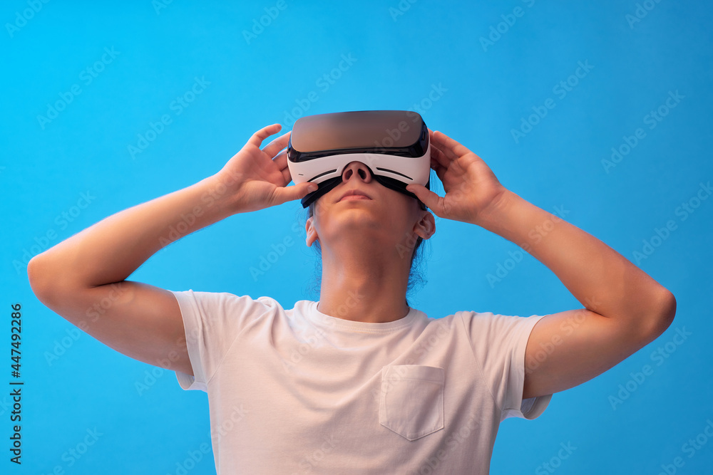 Young man using virtual reality headset. VR gadgets Young man using virtual reality headset. VR gadgets