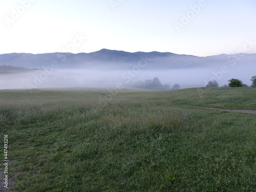 Cades Cove Great Smoky Mountains at sunrise with morning mist