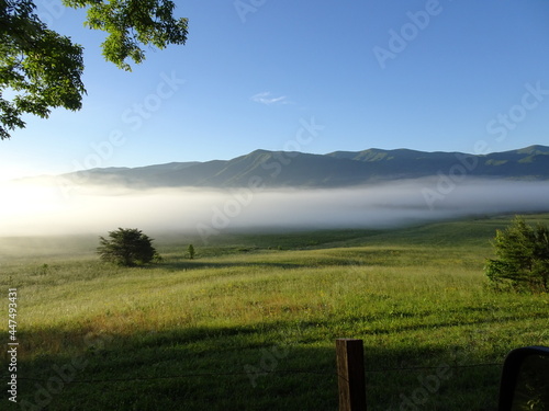 Cades Cove Great Smoky Mountains at sunrise with morning mist