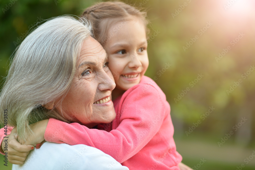 Happy grandmother and granddaughter in the park Happy grandmother and granddaughter in the park