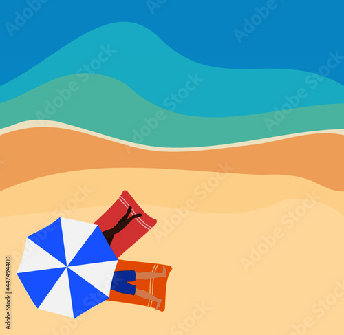 Beach overhead couple under umbrella ocean sunbathing