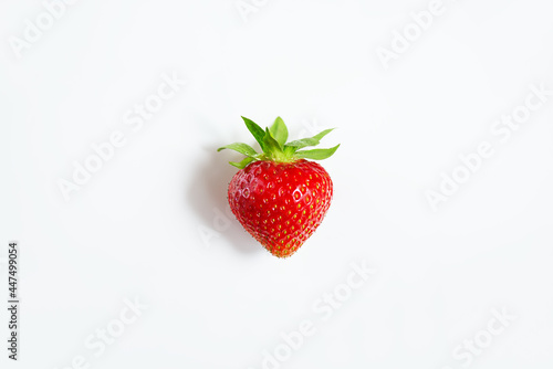 Ripe strawberry berry on a white background. 