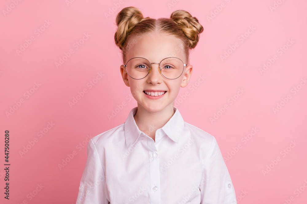 Photo of little cute girl wear white shirt spectacles isolated on pastel pink color background Photo of little cute girl wear white shirt spectacles isolated on pastel pink color background
