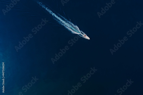 Speedy motor boat is sailing in blue ocean. Aerial view © artifirsov