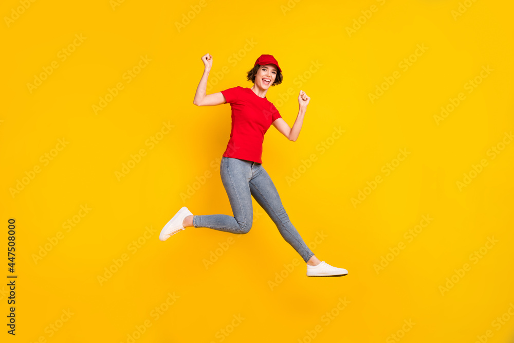 Full size profile photo of nice hooray brown hair lady jump wear t-shirt cap isolated on yellow background
