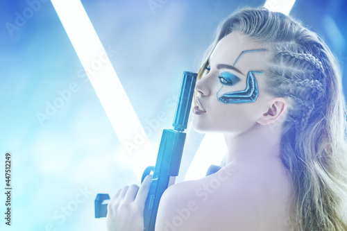 armed blonde cyborg photo