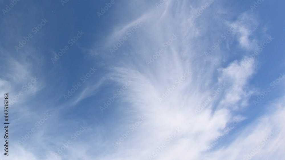 Thin cirrus clouds in the blue sky, time-lapse. Cloudy sky video.
Thin cirrus clouds in the blue sky, time-lapse. Cloudy sky video.