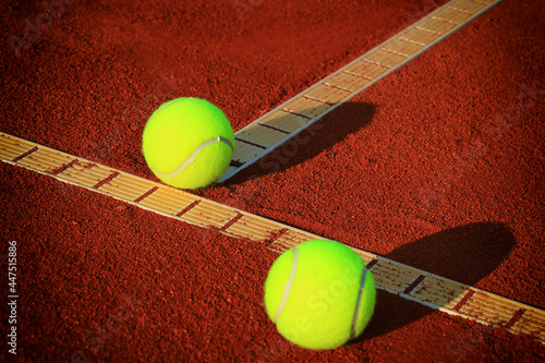 Tennis balls on a tennis clay court © Željko Radojko