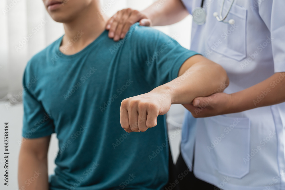 Close-up of a physiotherapist treating a patient at a clinic. Close-up of a physiotherapist treating a patient at a clinic.