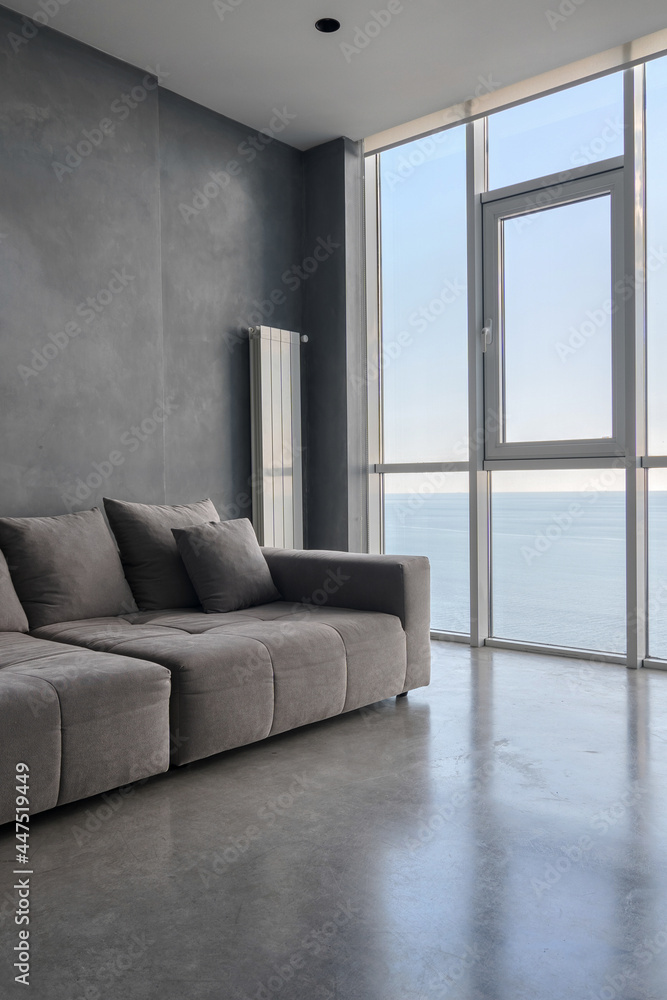 Fototapeta premium Living room with panoramic window and comfort couch