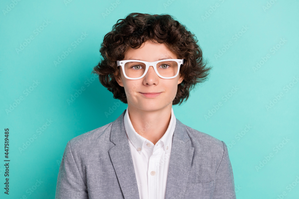 Photo of pretty adorable school boy wear grey jacket spectacles smiling isolated turquoise color background Photo of pretty adorable school boy wear grey jacket spectacles smiling isolated turquoise color background