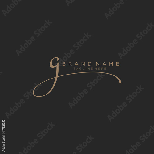 Letter G gold handwritten logo vector design template. Black background.