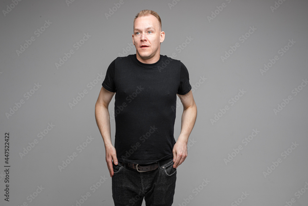 adult emotional caucasian man with short fair hair sigh and looks aside adult emotional caucasian man with short fair hair sigh and looks aside