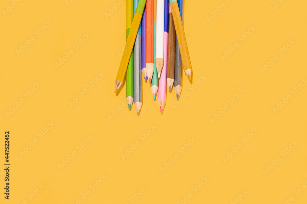 Colored pencils in studio background