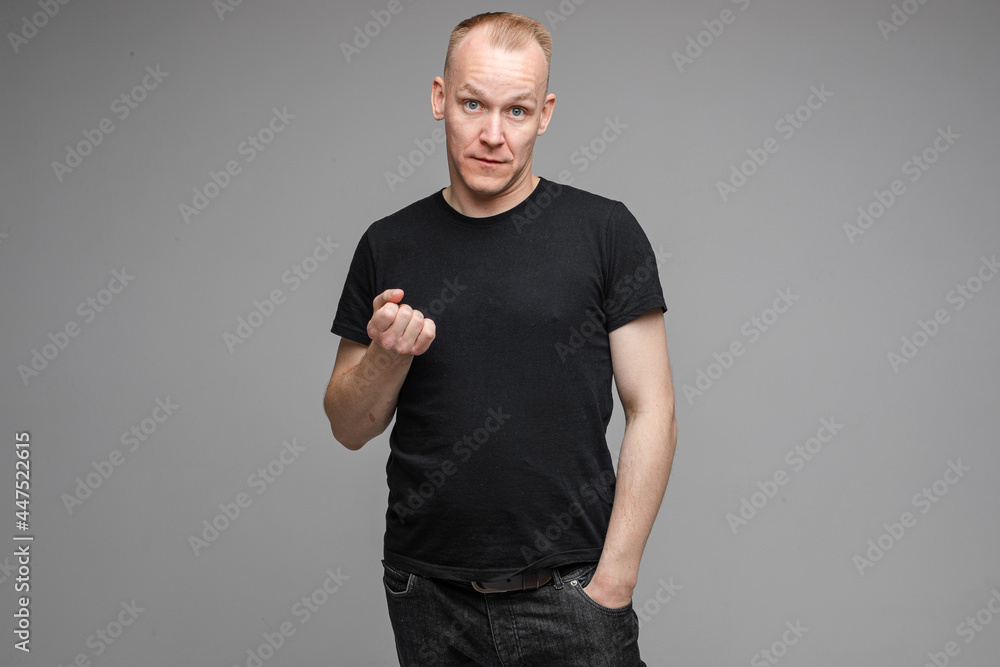 Man showing fist with serious face. Man showing fist with serious face.
