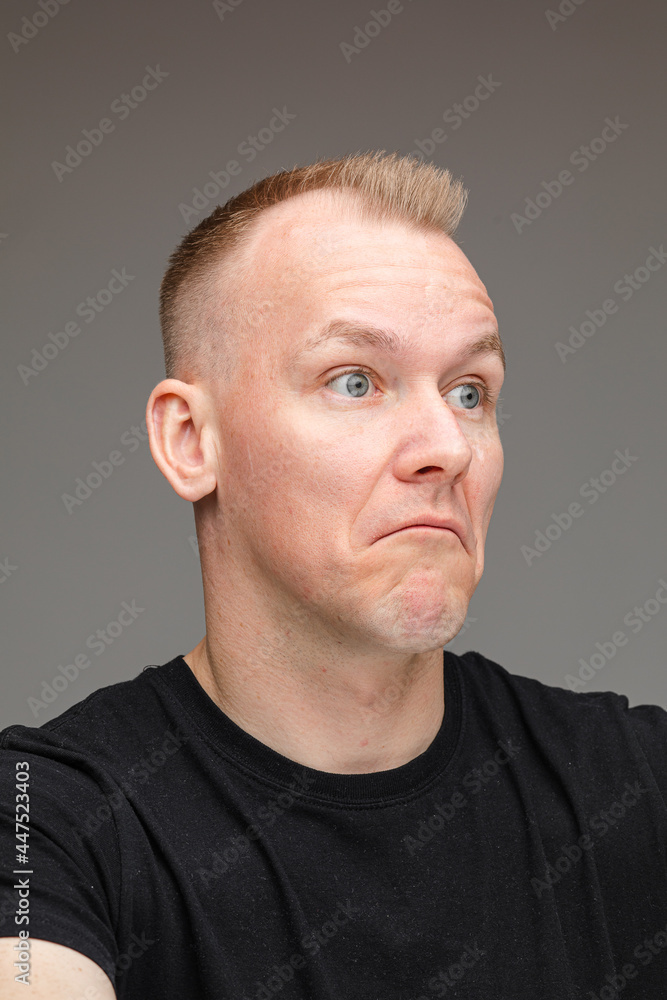 Doubtful Caucasian man looking away. Doubtful Caucasian man looking away.