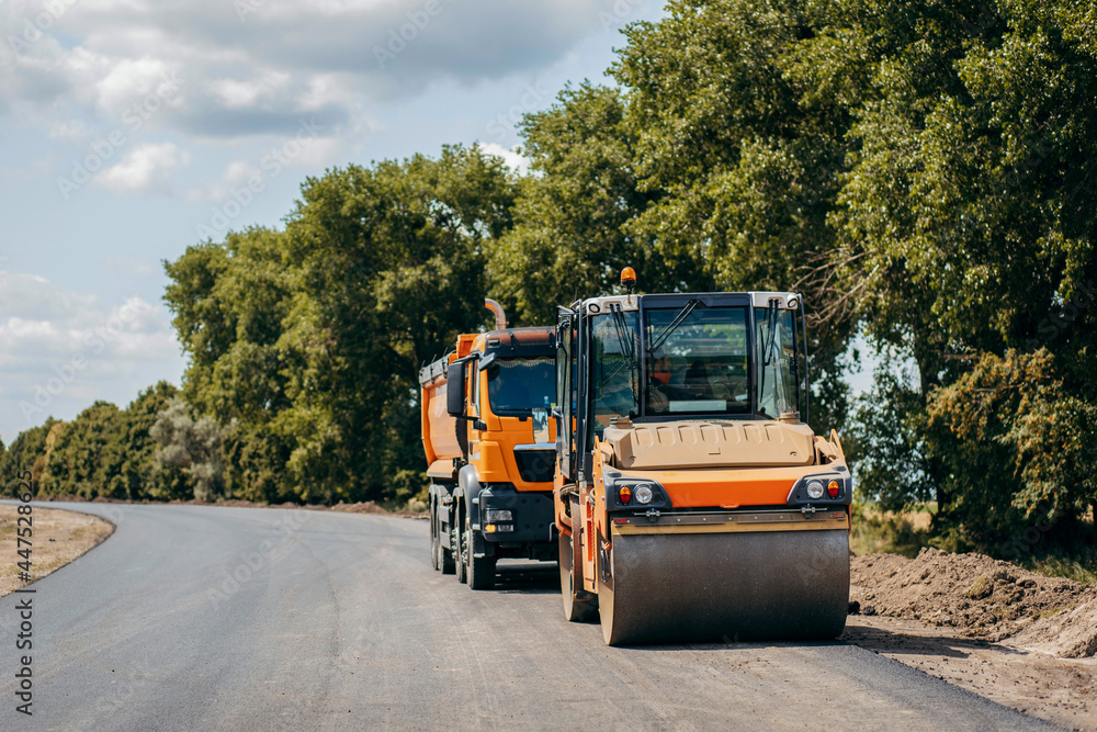 Fototapeta premium Road service repairs the highway