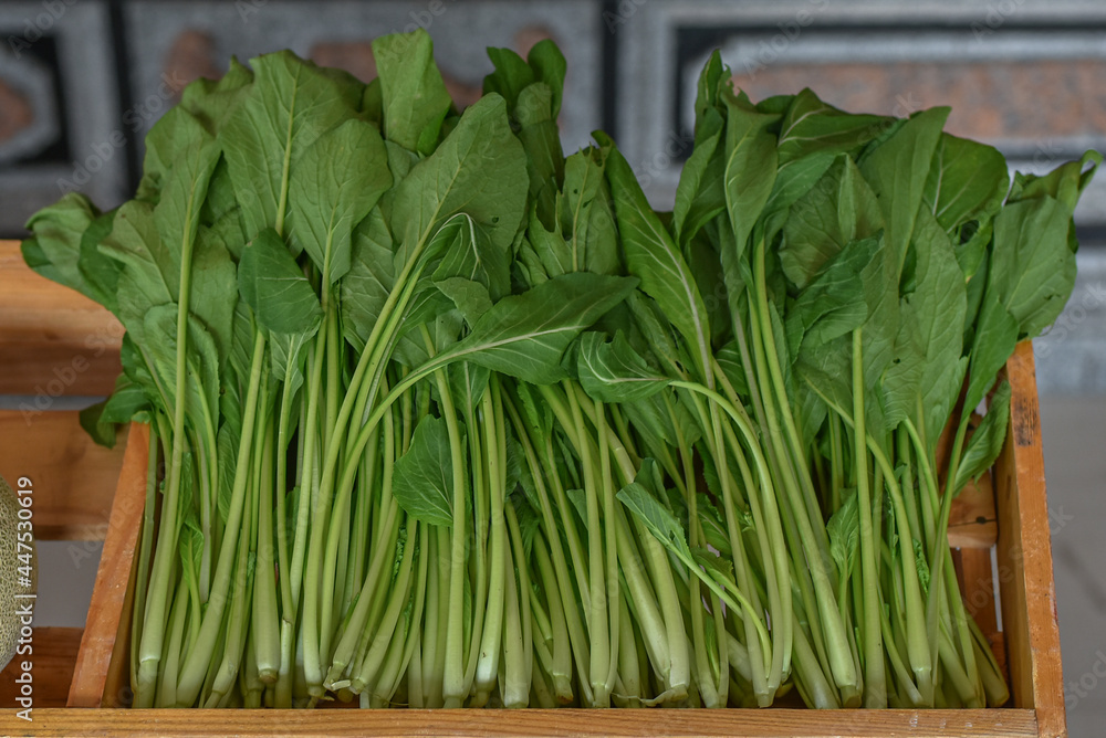 green vegetables sold in wooden boxes green vegetables sold in wooden boxes