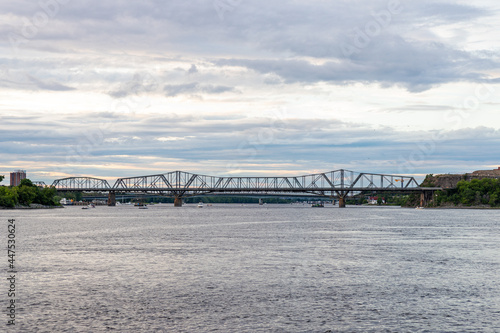 Panoramic view of Ottawa River and Alexandra Bridge from Ottawa to Gatineau city of Quebec, Canada in summer evening