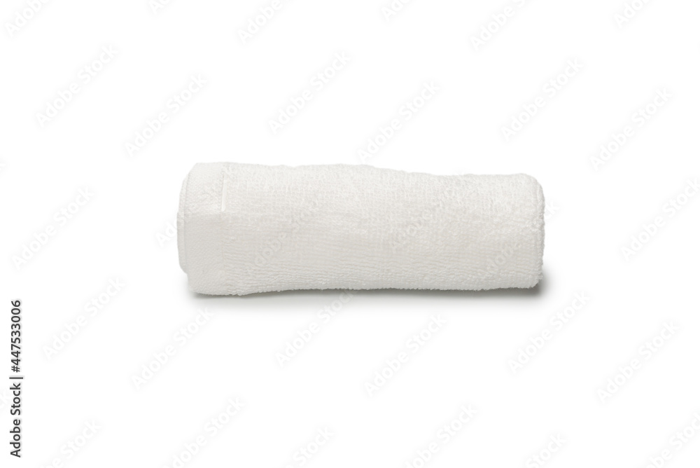 White fluffy cotton towel isolated on a white background. White fluffy cotton towel isolated on a white background.