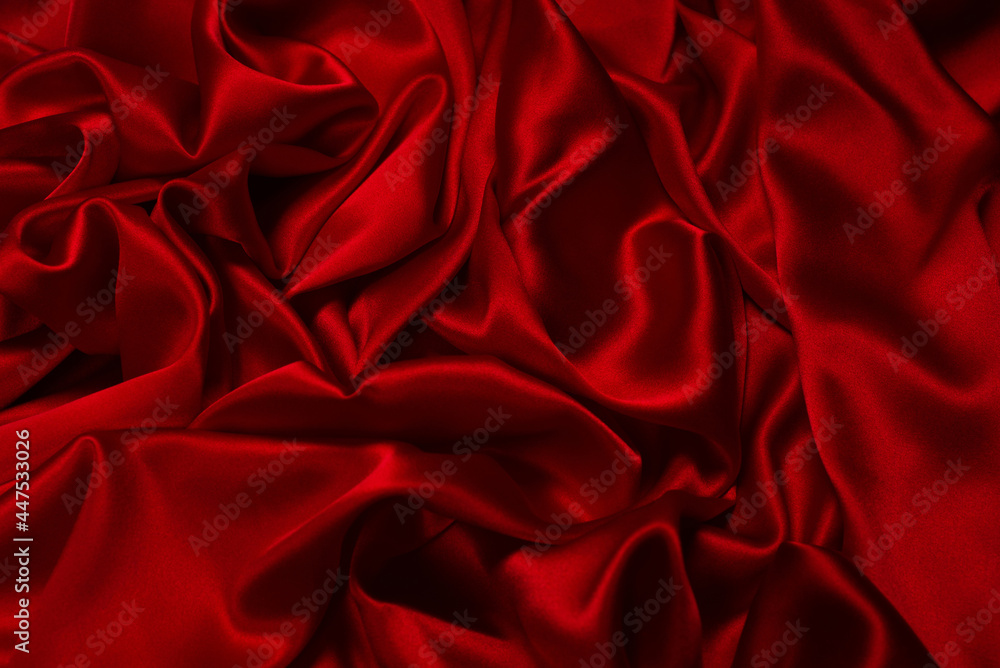 Fototapeta premium Rich and luxury red silk fabric texture background.