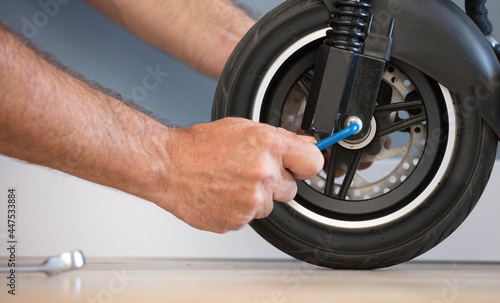 Electric motorcycle maintenance service concept. Repair service. Technological concept. © Fernando
