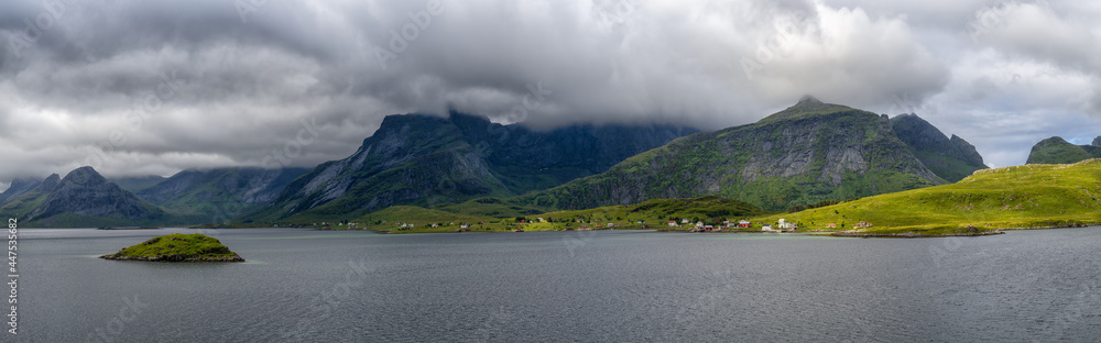 panorama view of the Lofoten Islands in northern Norway under an overcast and cloudy sky with a view of the Selfjorden
