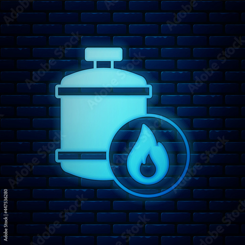 Glowing neon Propane gas tank icon isolated on brick wall background. Flammable gas tank icon. Vector