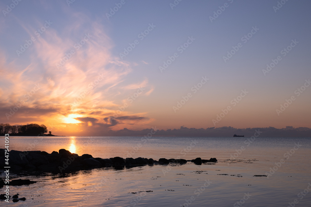 Epic sunrise over the sea with dramatic sky.