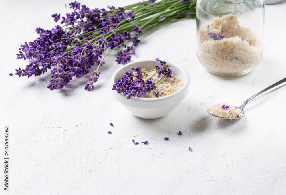 Lavender infused sugar. Flower sugar with fresh lavender in white bowl on white background. Lavender infused sugar. Flower sugar with fresh lavender in white bowl on white background.