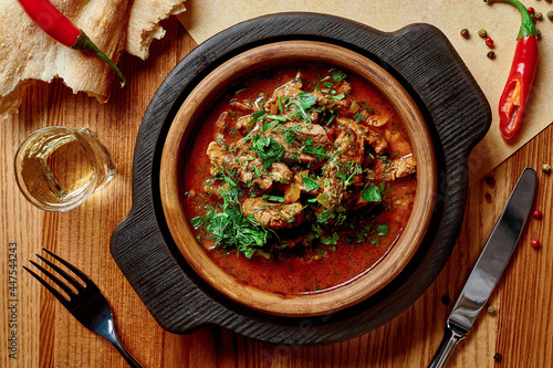 Georgian dish Chashushuli, spicy veal stewed in tomato gravy photo