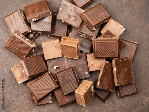 Konstfotografi assorted chocolates on a dark table. Chocolate bar. Top view