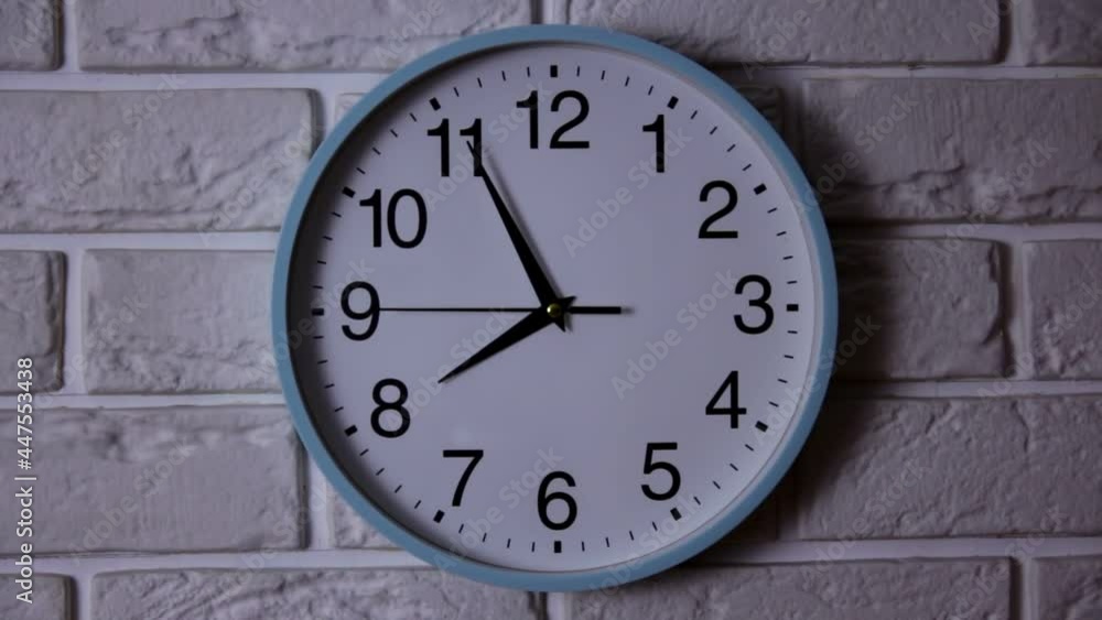 The Time Is 8.00 AM Or PM On A Wall Clock With A Black Second Hand On A White Brick Wall. Time concept The Time Is 8.00 AM Or PM On A Wall Clock With A Black Second Hand On A White Brick Wall. Time concept