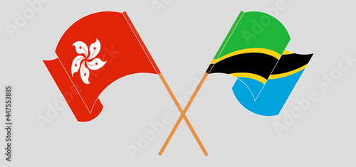Crossed and waving flags of Hong Kong and Tanzania