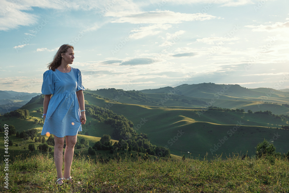 Woman in blue dress in Altai mountain,